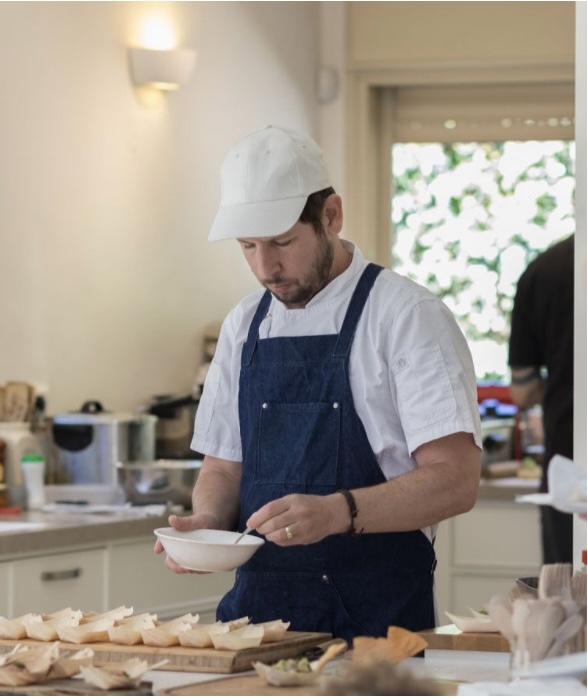 Chef Dan working in a residential kitchen, plating canapés