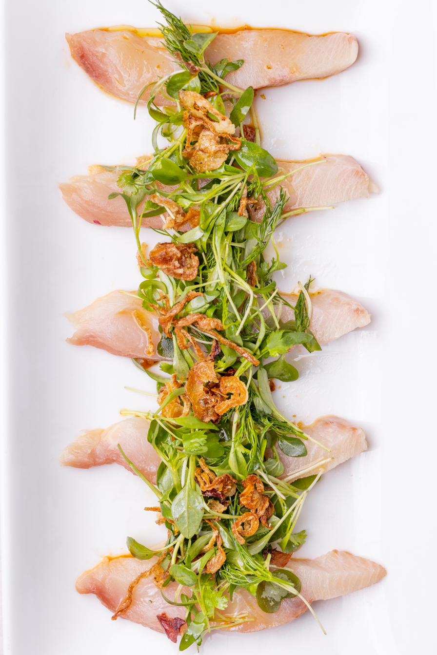 Hamachi crudo with crispy shallots and microgreens