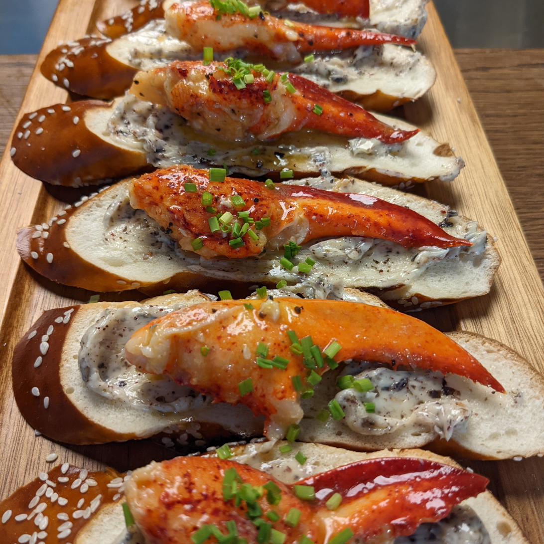 Lobster claw on pretzel toast with truffle mayo