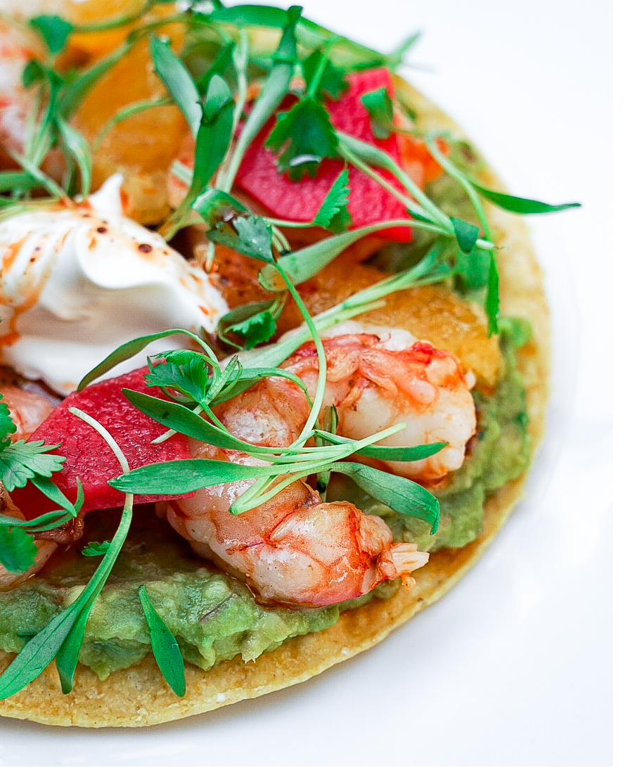 Shrimp tostada with watermelon, microgreens, and chili crema